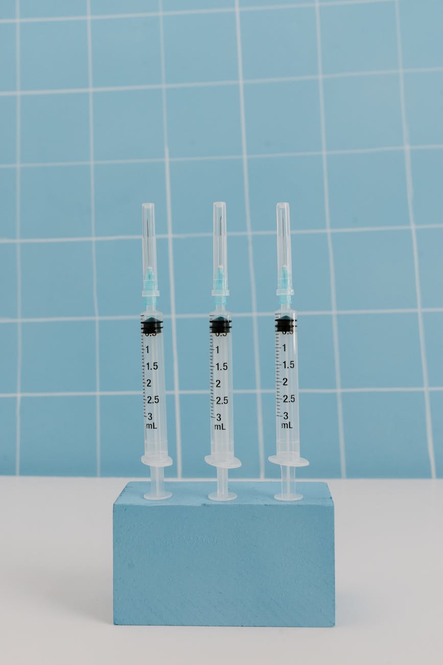syringes on top of blue block