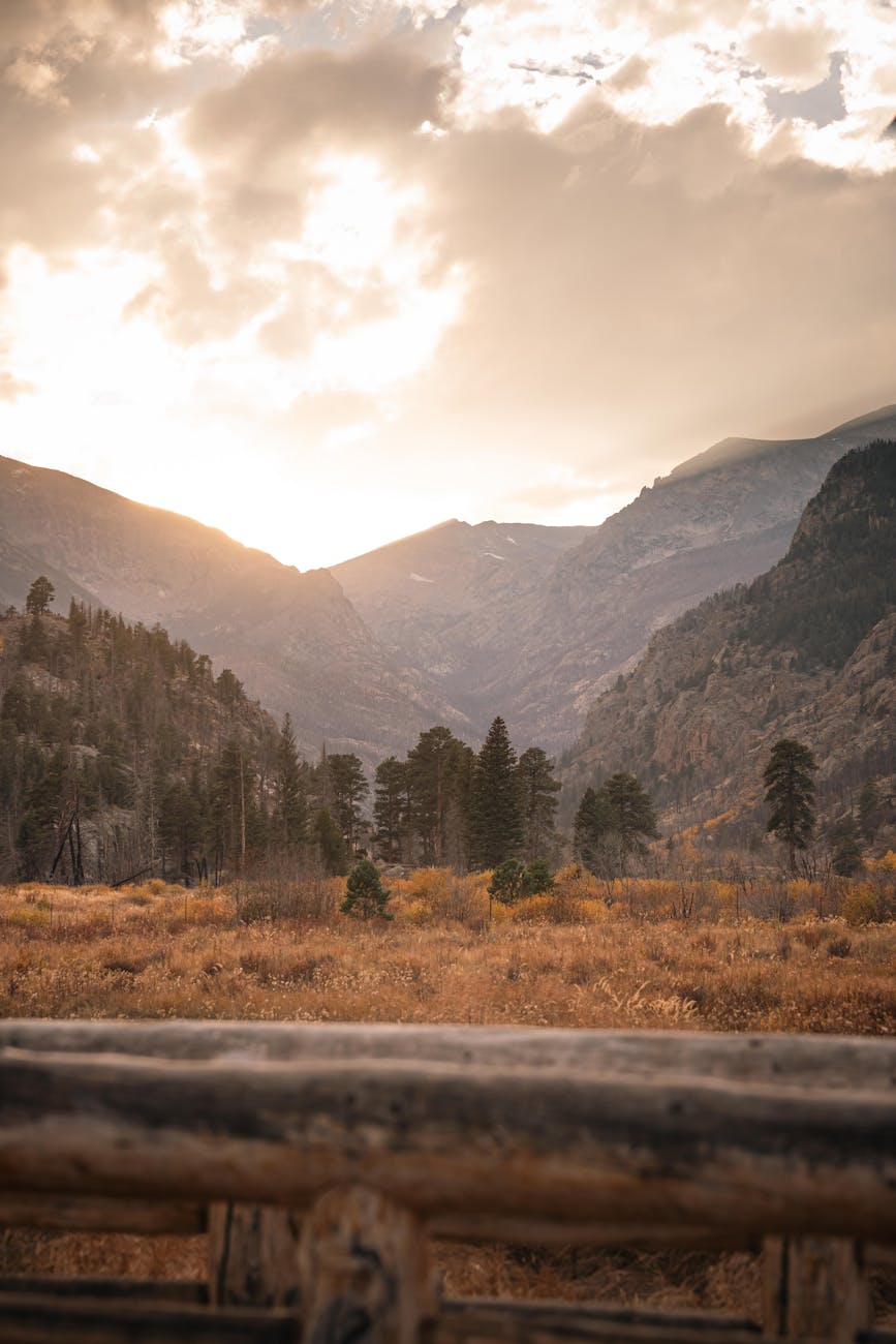 sunset over majestic mountain range in fall